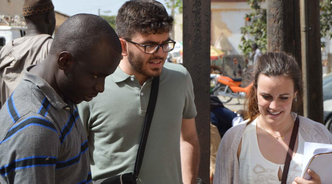 Volunteers talking to locals while out in the city Projects Abroad French Language Project volunteers interacting with locals in the while on a trip around the city